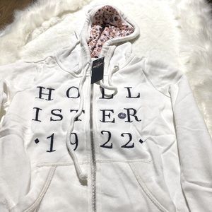 Plush white smooth knit fabric hoodie for sale by Hollister.